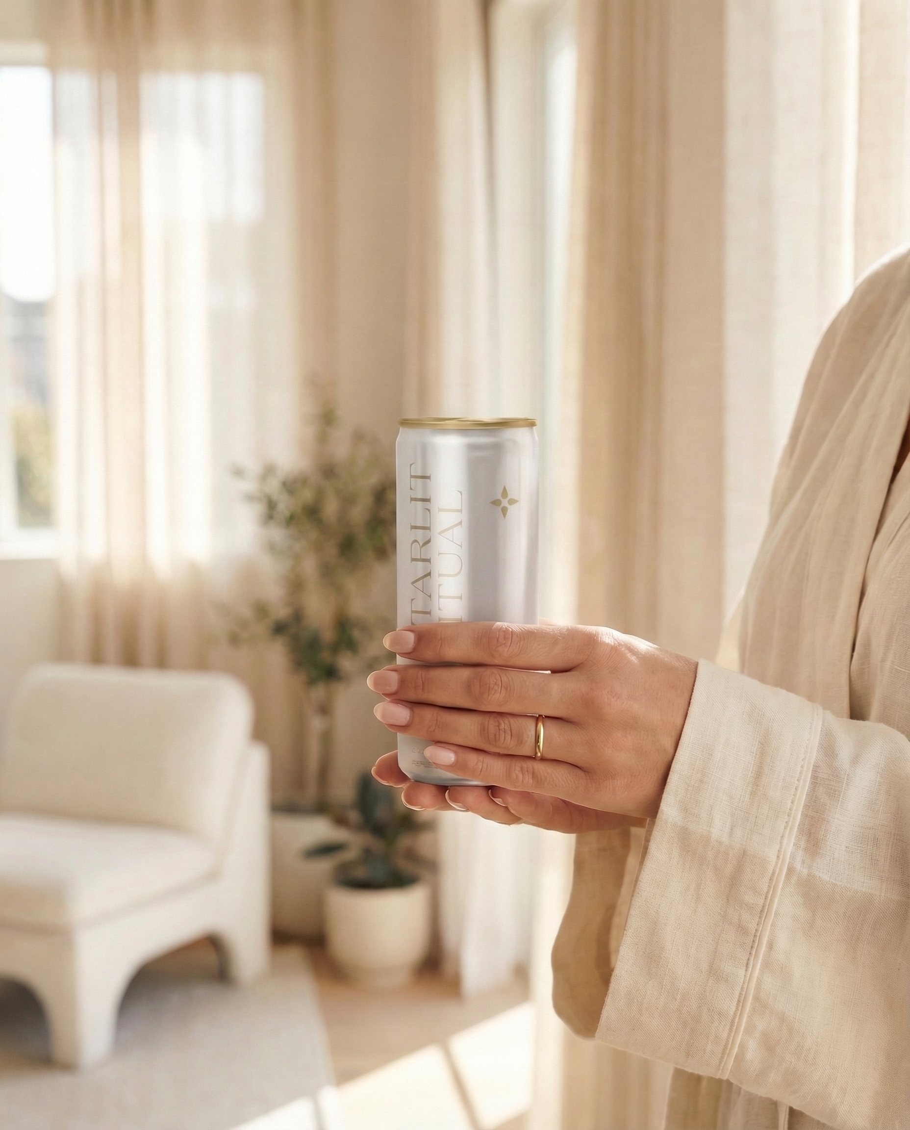 Star Sweat lifestyle — hands holding a can of luxury hydrogen water